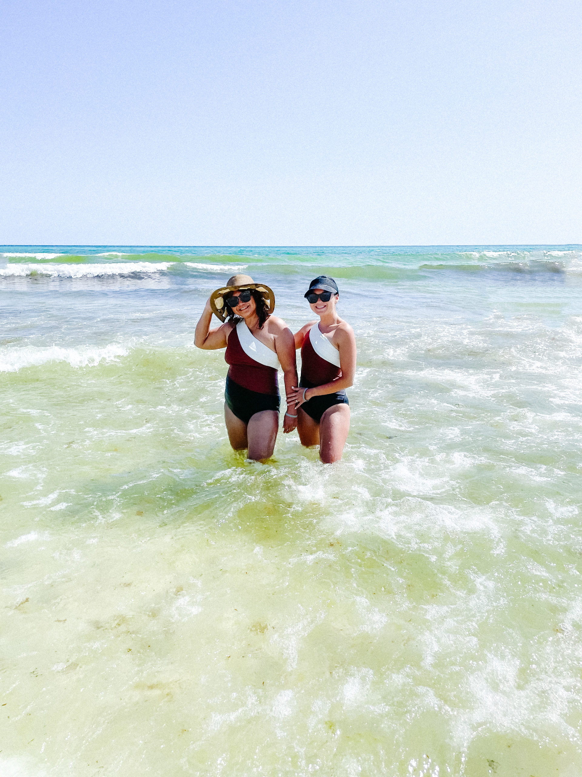 Mom and daughter matching swimsuit photo, standing in the ocean at Rosemary Beach Florida